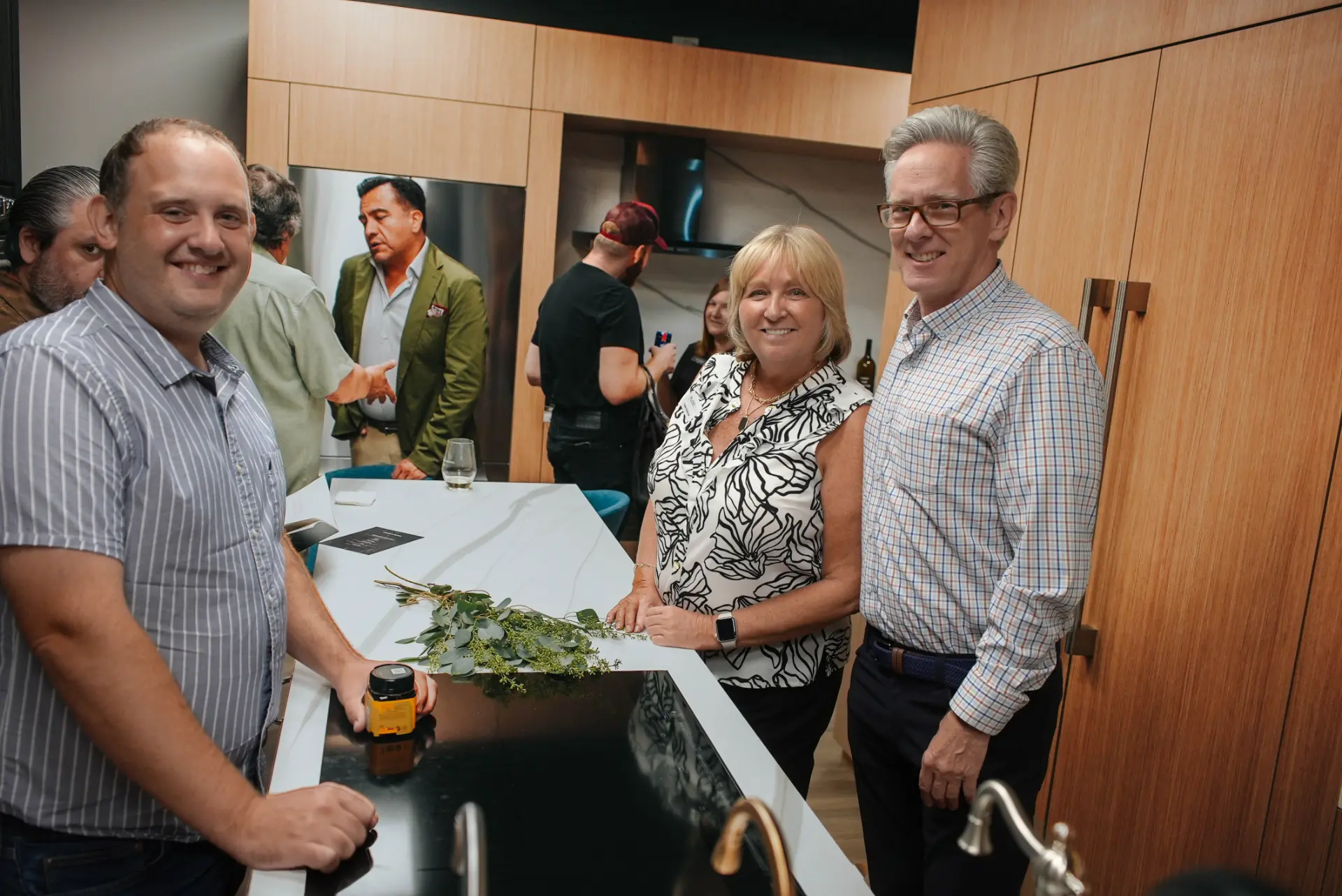 Guests at the Fuse showroom kitchen island.