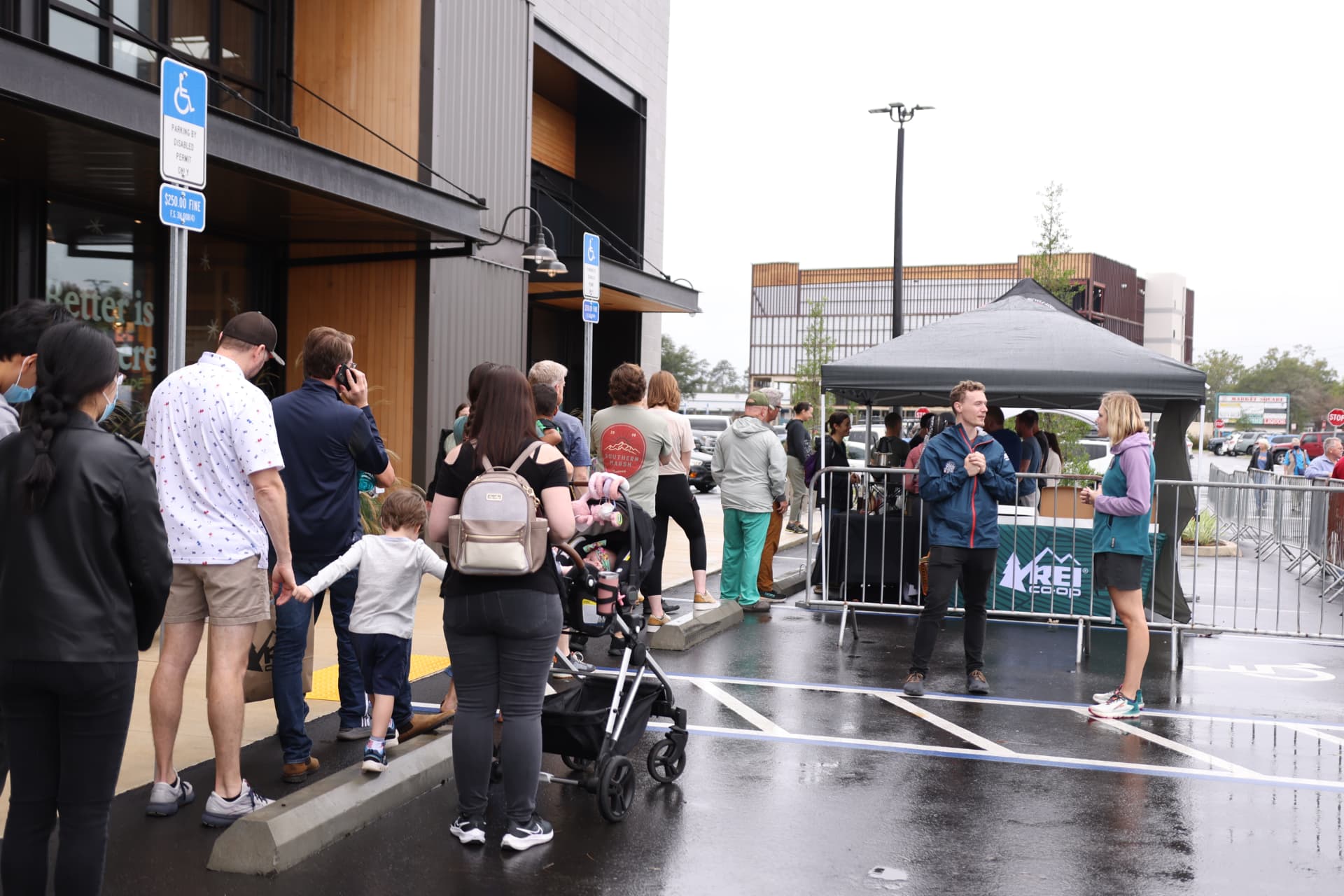 Guests arriving outside the REI Tallahassee store opening.